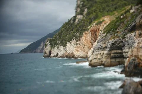 Waves hitting rocks at the seaside Stock Photos
