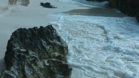 Waves hitting rocks at shore Stock Footage 87141953