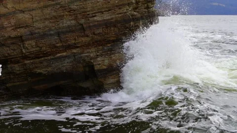 Waves hitting the rocks in slow motion Stock Footage 159706094