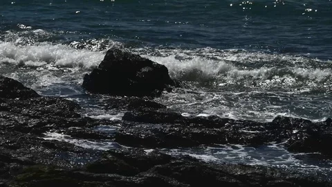 Waves hitting rocks tight Stock Footage 126669715