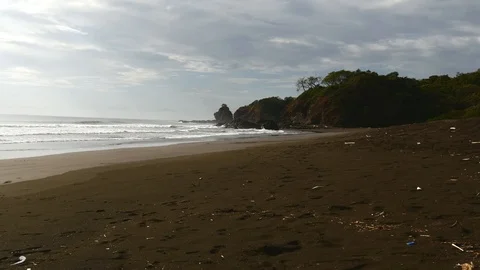 Waves hitting rocks wide Stock Footage 126791135