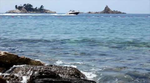Waves hitting the rocky Beach Stock Footage 1019414