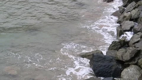 Waves hitting the rocky beach at North Sands in Devon Stock Footage 157736076
