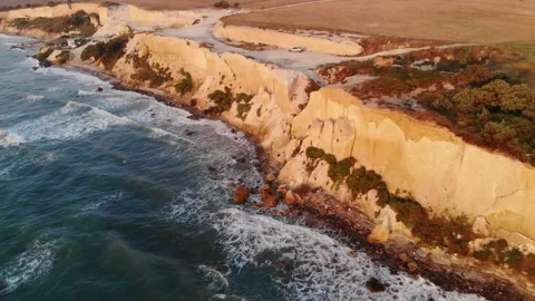Waves hitting rocky cliffs Stock Footage 137561346