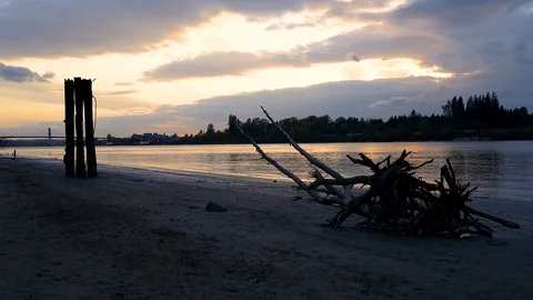 Waves hitting shore during peaceful beach sunset Stock Footage 108473624
