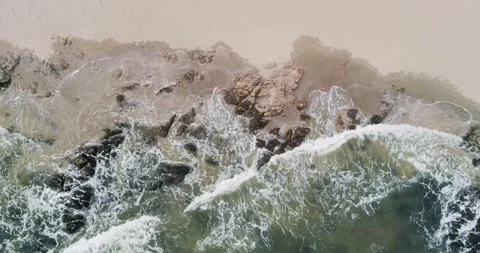 Waves hitting the shore Stock Footage 296603709