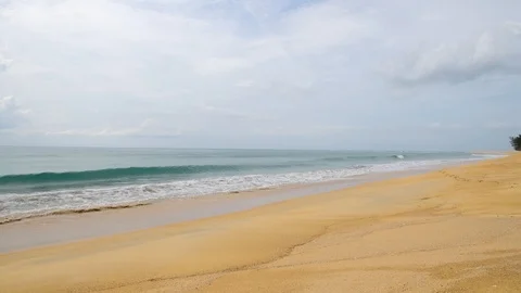 Waves hitting the shore. Soft wave of blue sea on sandy beach. Background Stock Footage 104878787
