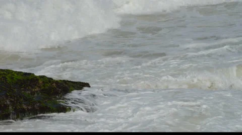 Waves Hitting the Stone in the Beach Stock Footage 33528186