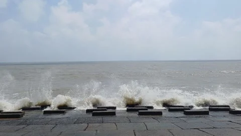 Waves hitting stone blocks in mandarmani Stock Footage 272231361