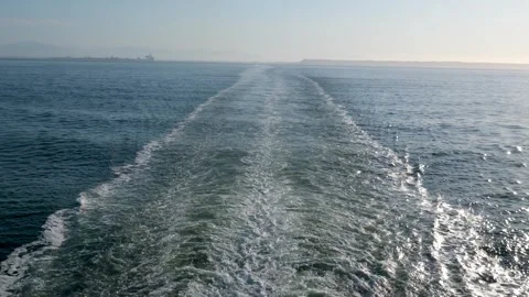Waves horizon ship Wake of vessel. Wide wake trail from boat. Back view. Ocean Stock Footage 316092498