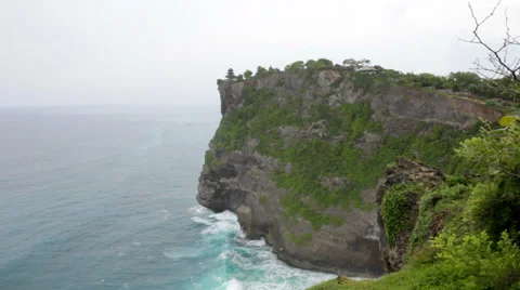 Waves of the Indian Ocean break about coastal rock Stock Footage 37014948