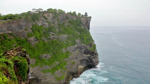 Waves of the Indian Ocean break about coastal rock Stock Footage 37022045