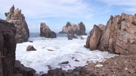 Waves of the Indian Ocean into Kelumbayan Rocks Stock Footage 39776479