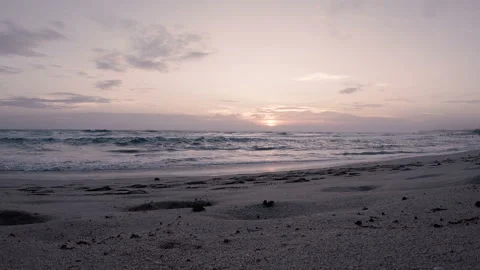 Waves of the Indian ocean at sunset on a deserted sandy beach Stock Footage 86694265