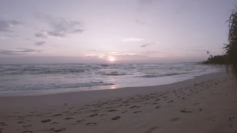 Waves of the Indian ocean at sunset on a deserted sandy beach Video stock 86694819