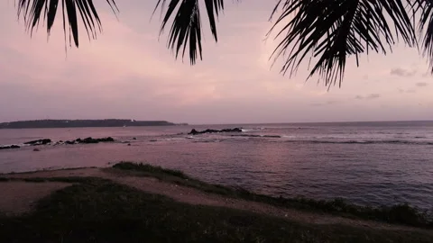 Waves of the Indian ocean at sunset on a deserted sandy beach Video stock 86700393