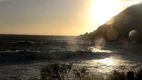 Waves on the Italian coast at the sunset Stock Footage 86521820