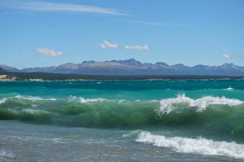 Waves in the lake with a view of mountain Stock Photos