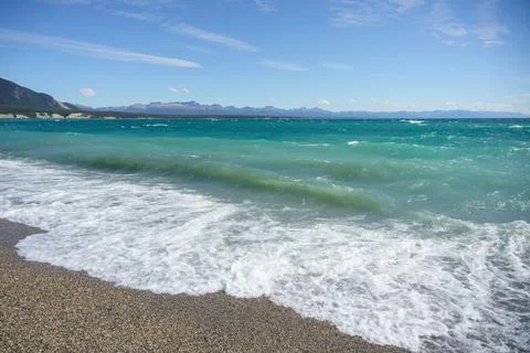 Waves in the lake with a view of mountain Stock Photos