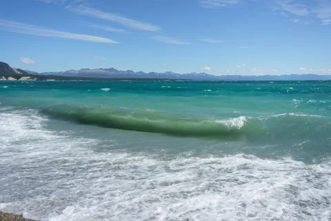 Waves in the lake with a view of mountain Stock Photos
