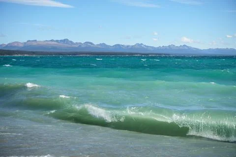 Waves in the lake with a view of mountain Stock Photos