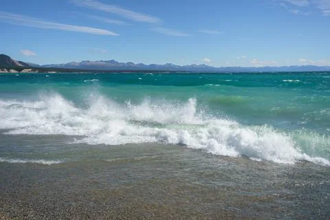 Waves in the lake with a view of mountain Stock Photos