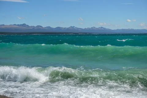 Waves in the lake with a view of mountain Stock Photos