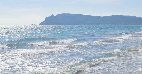 Waves landing on sandy beach. Clear blue water Stock Footage 82405865