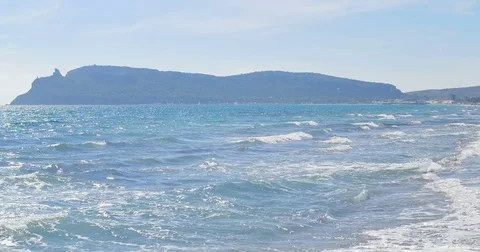 Waves landing on sandy beach. Clear blue water Stock Footage 82611903