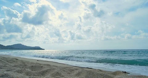 Waves landing on sandy beach. Clear blue water Stock Footage 82661965