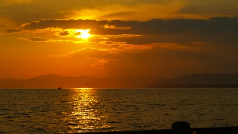 Waves landscape silhouette against nightfall sky Stockbeeldmateriaal 334223673