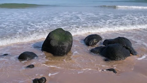 Waves lap around rocks Portrush beach scene Stock-Footage 304668887