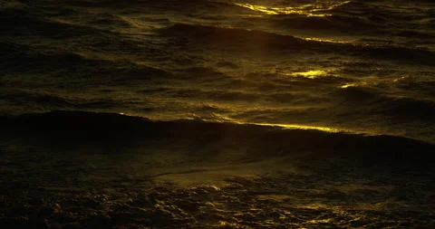 Waves lap beach during sunset 스톡 동영상 139378945