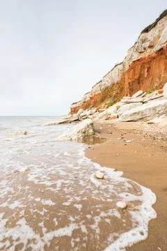 Waves lap up on Hunstanton beach Stock Photos