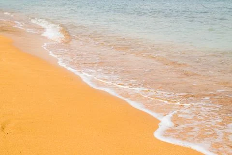Waves lap up on Ramla Beach Stock Photos