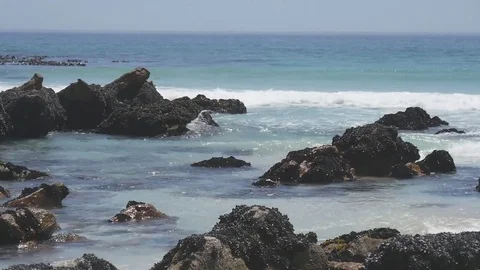 Waves lapping against a brilliant white sandy beach south of Cape Town Stock Footage 74729668