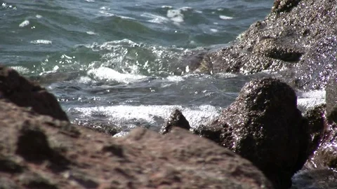 Waves Lapping Against Rocks in Baja California Sur, Mexico Stock Footage 92651258