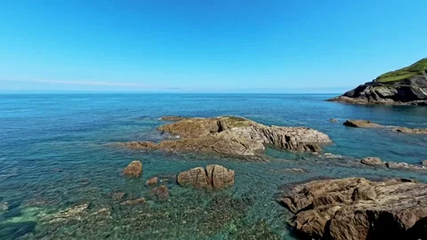 Waves lapping against the rocks on the rocky shoreline Stock-Footage 281430752