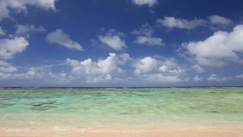 Waves Lapping and Clouds Flowing Stock Footage 324922852