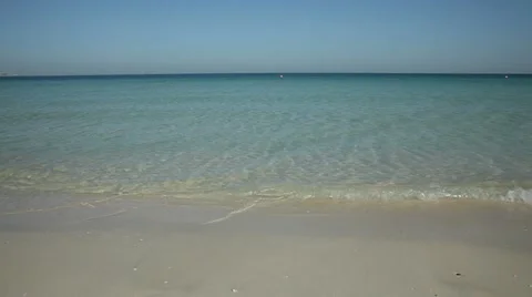 Waves lapping a beach, Dubai, United Arab Emirates Stock Footage