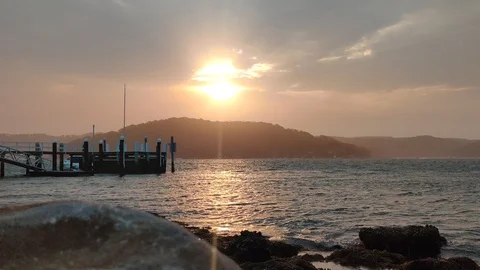 Waves lapping during beautiful sunset Stock Footage 122659172