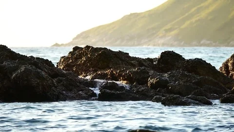 The waves lapping rocks  in the sea in the summer season at Andaman Sea or Pa Stock Footage 81345468