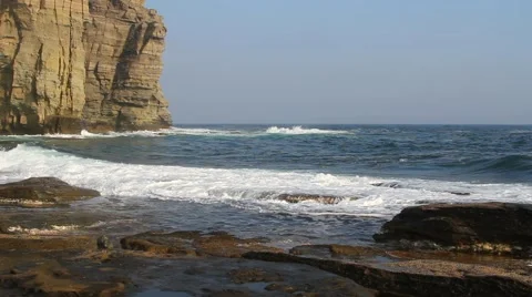 Waves lapping on the rocky coast Video stock 57639124