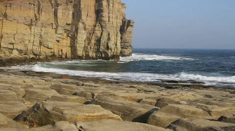 Waves lapping on the rocky coast Stock Footage 57639468