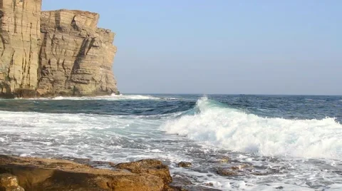 Waves lapping on the rocky coast Stock Footage 57639836