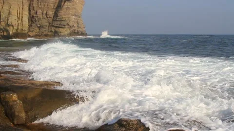 Waves lapping on the rocky coast Video stock 57639905