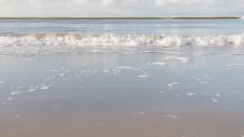 Waves lapping on a sandy beach. Stock Footage 325216945