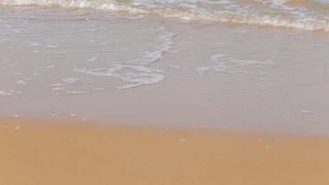 Waves lapping on a sandy shore, no people, summer time Stock Footage 97259499