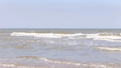 Waves lapping on a sandy shore, no people, summer time Stock Footage 97259518