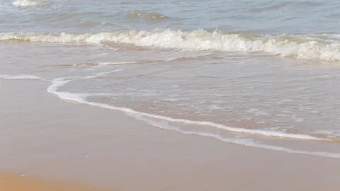 Waves lapping on a sandy shore, no people, summer time Stock Footage 97259530